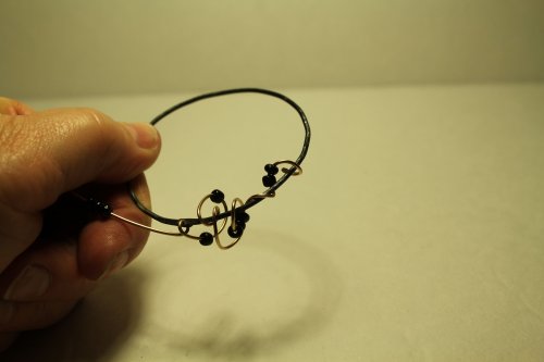 Judy Freyer Thompson's Embellishing Twisted Wire Hoop Earrings - , Contemporary Wire Jewelry, , Hammer the end of the bronze wire into a paddle.